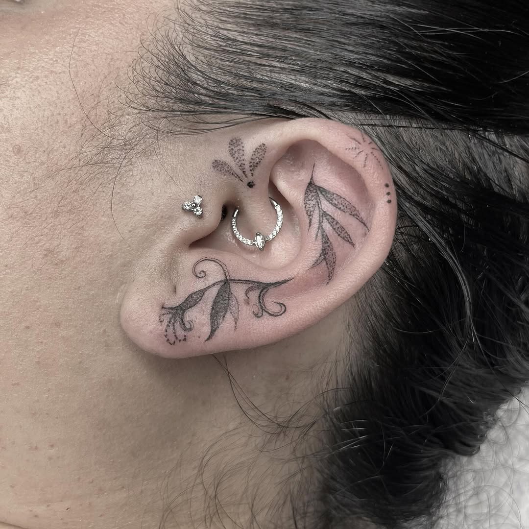 Elegant floral ear tattoo with intricate details