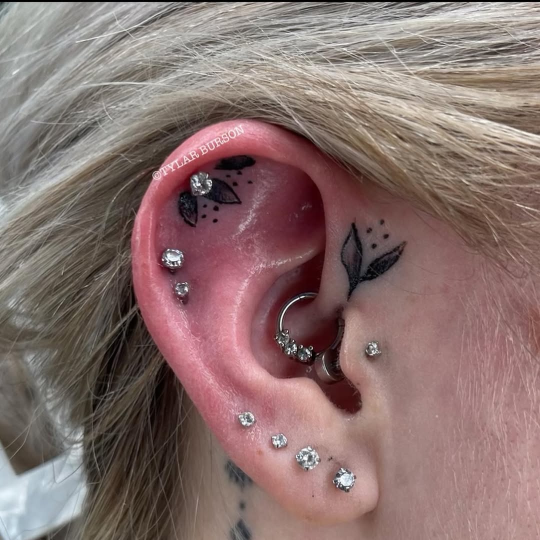 Delicate floral ear tattoos with sparkling accents