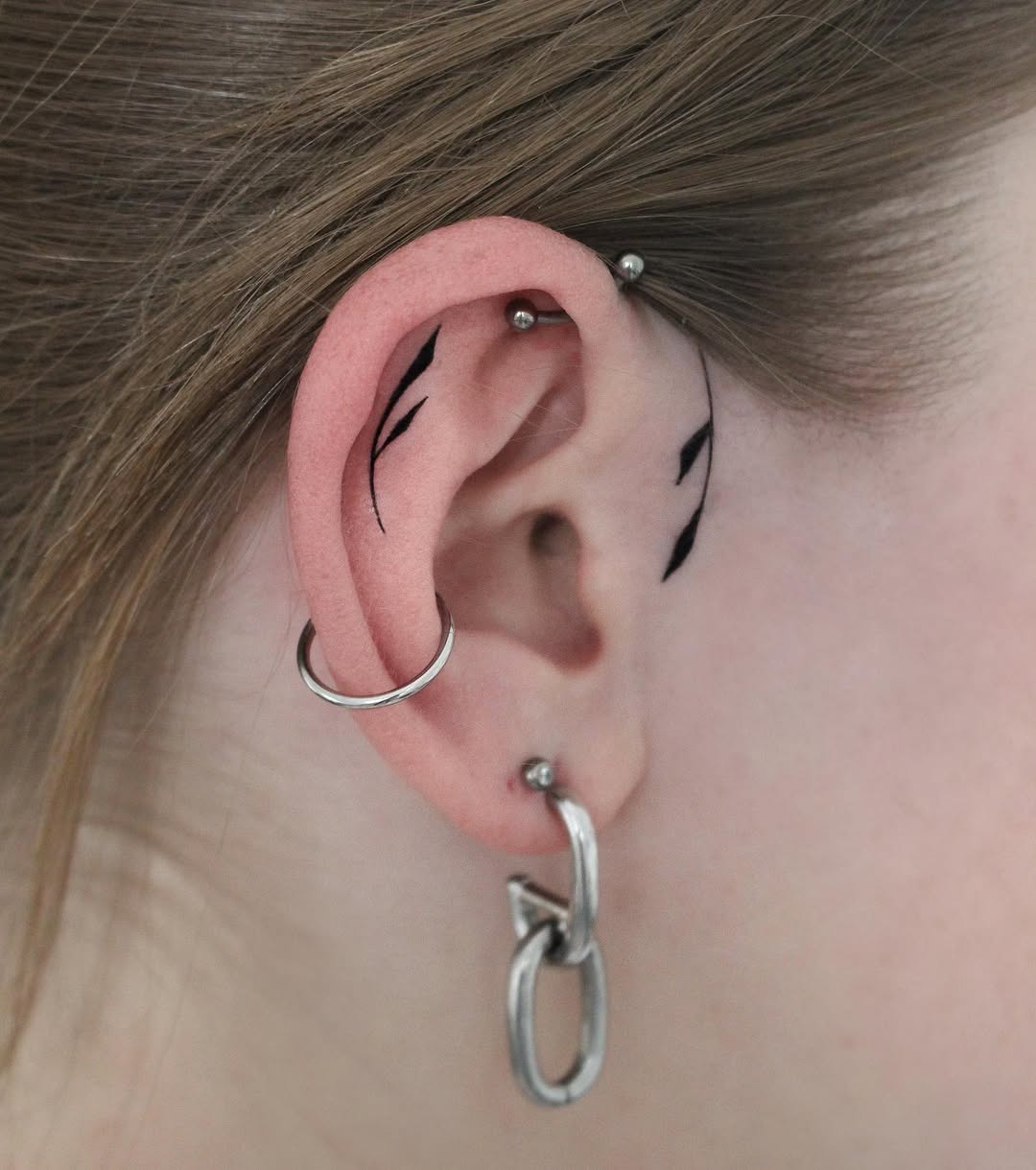 Unique minimalistic ear tattoo design ideas