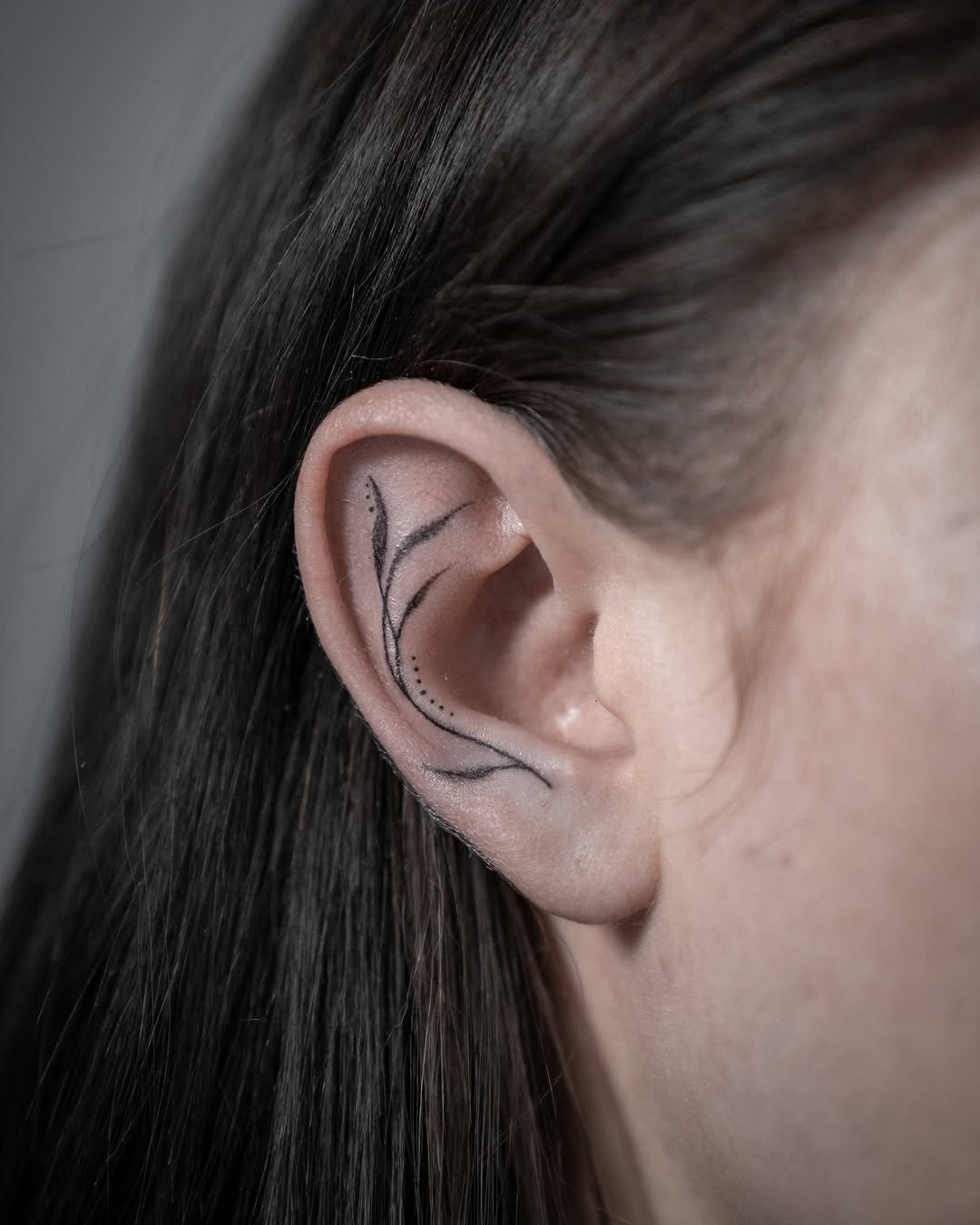 Elegant floral design gracing the ear.