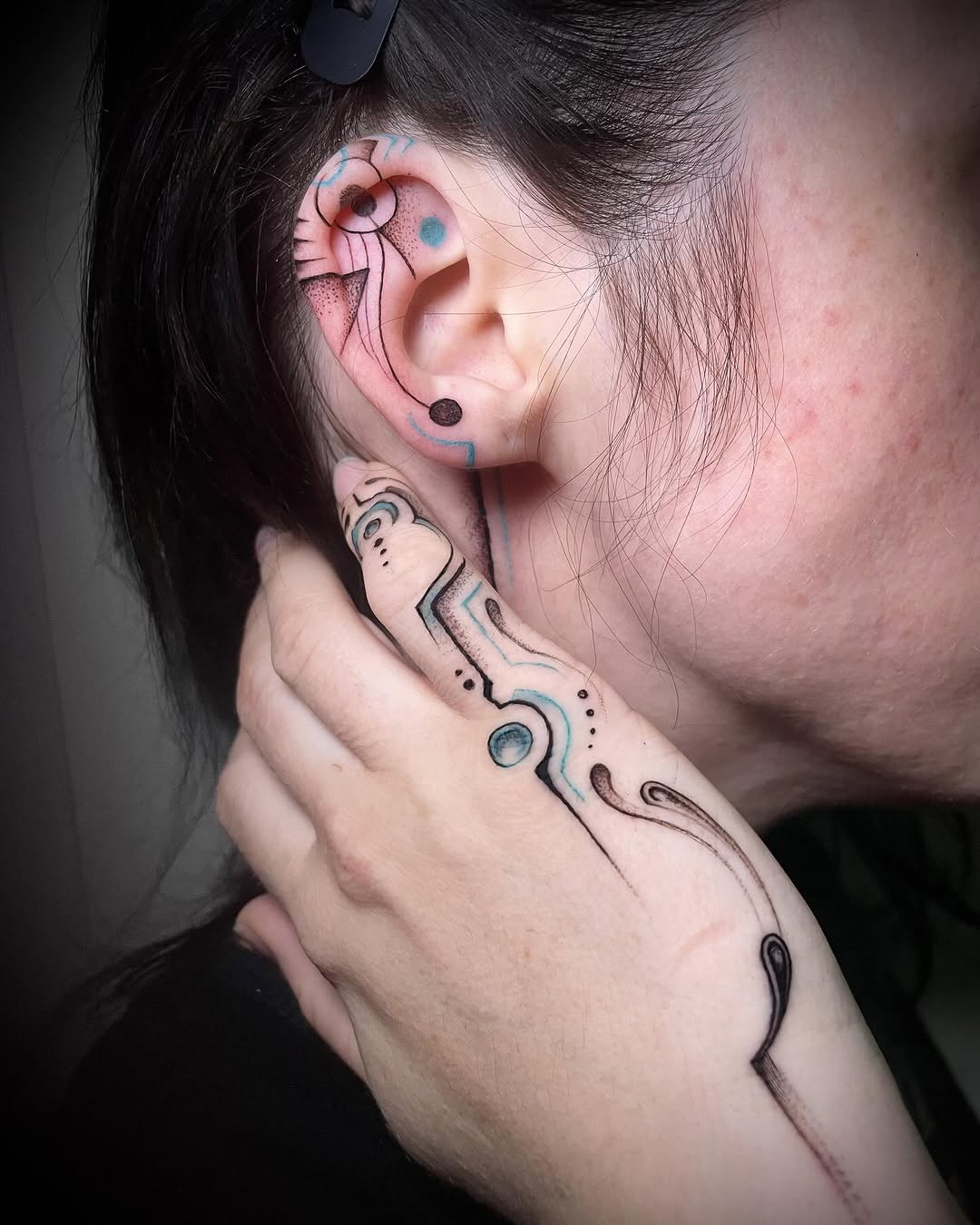 Modern abstract ear tattoo art inspiration