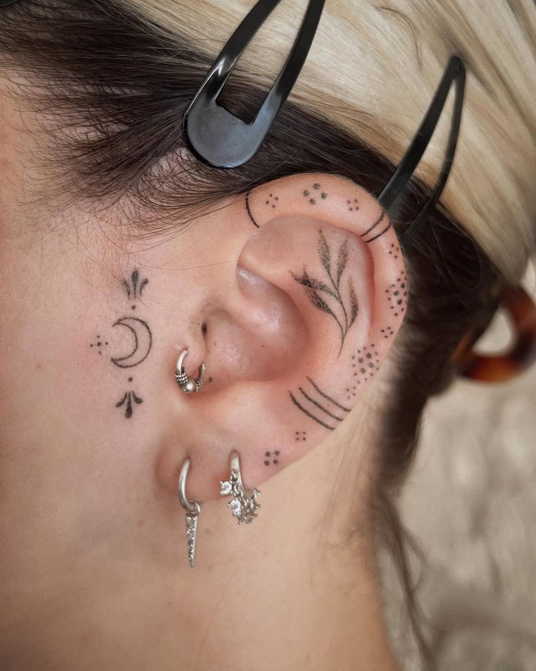 Intricate ear tattoos for a unique vibe