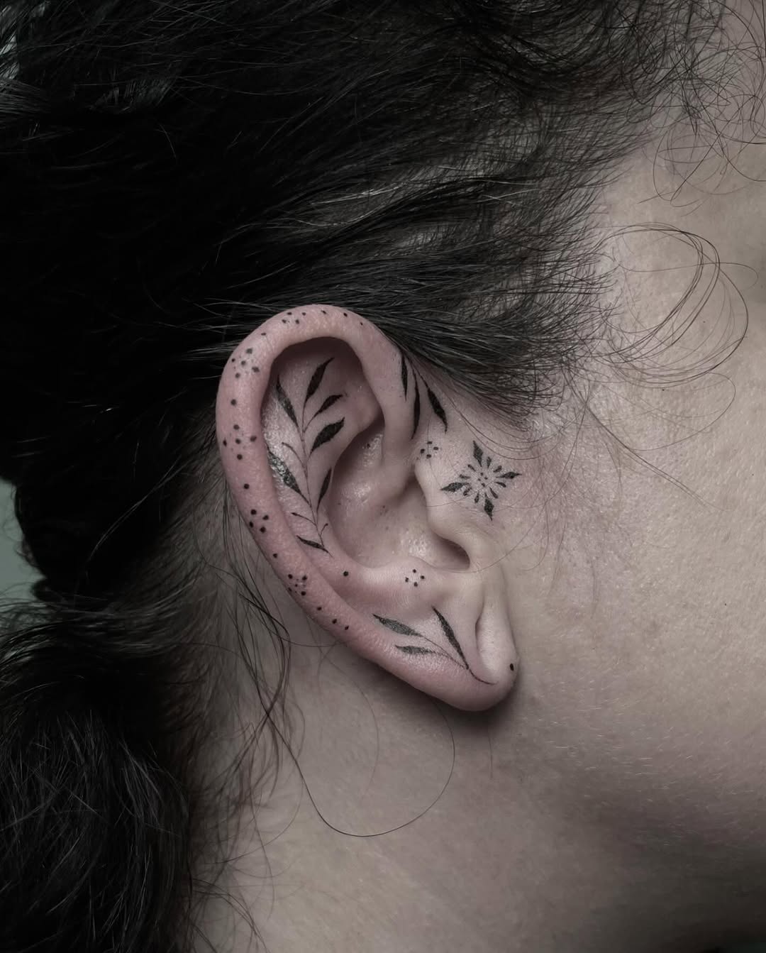 Delicate floral ear tattoos showcasing nature's beauty