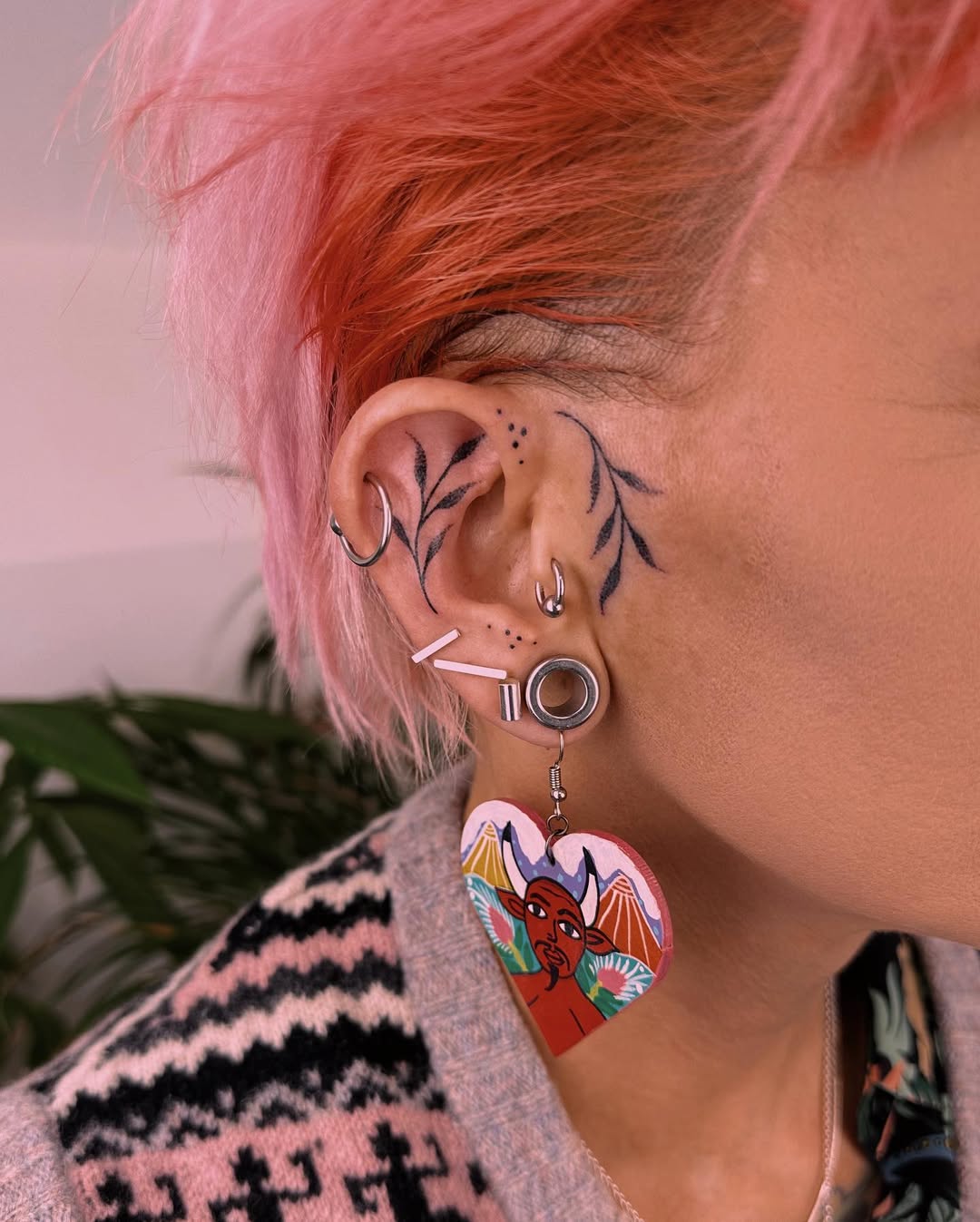 Elegant ear tattoos with floral designs