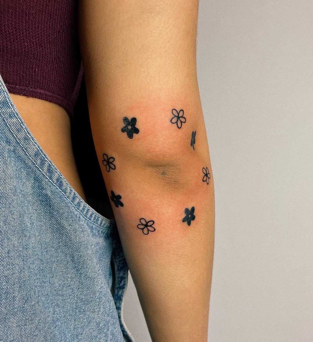 Charming flower tattoos for the elbow area