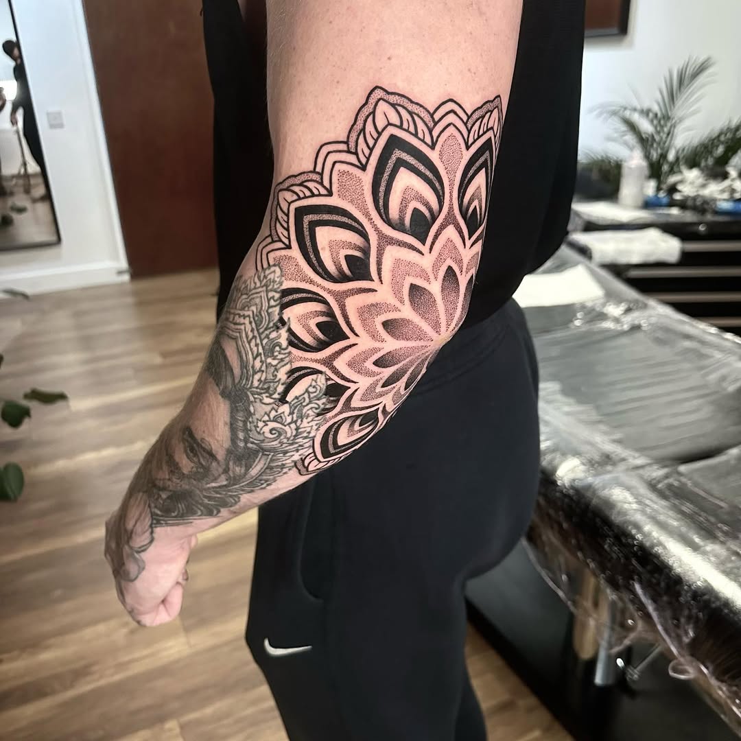 Stunning mandala elbow tattoo with intricate details