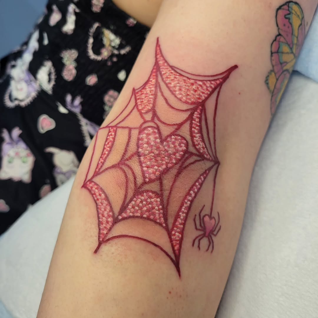 Intricate spider web heart tattoo design