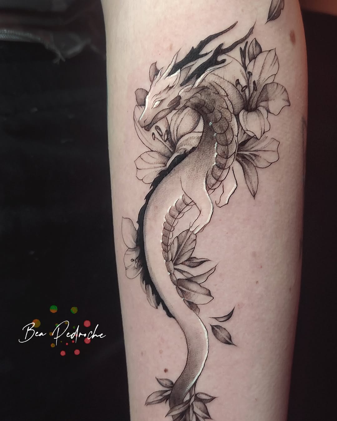 A graceful dragon entwined with blooming flowers