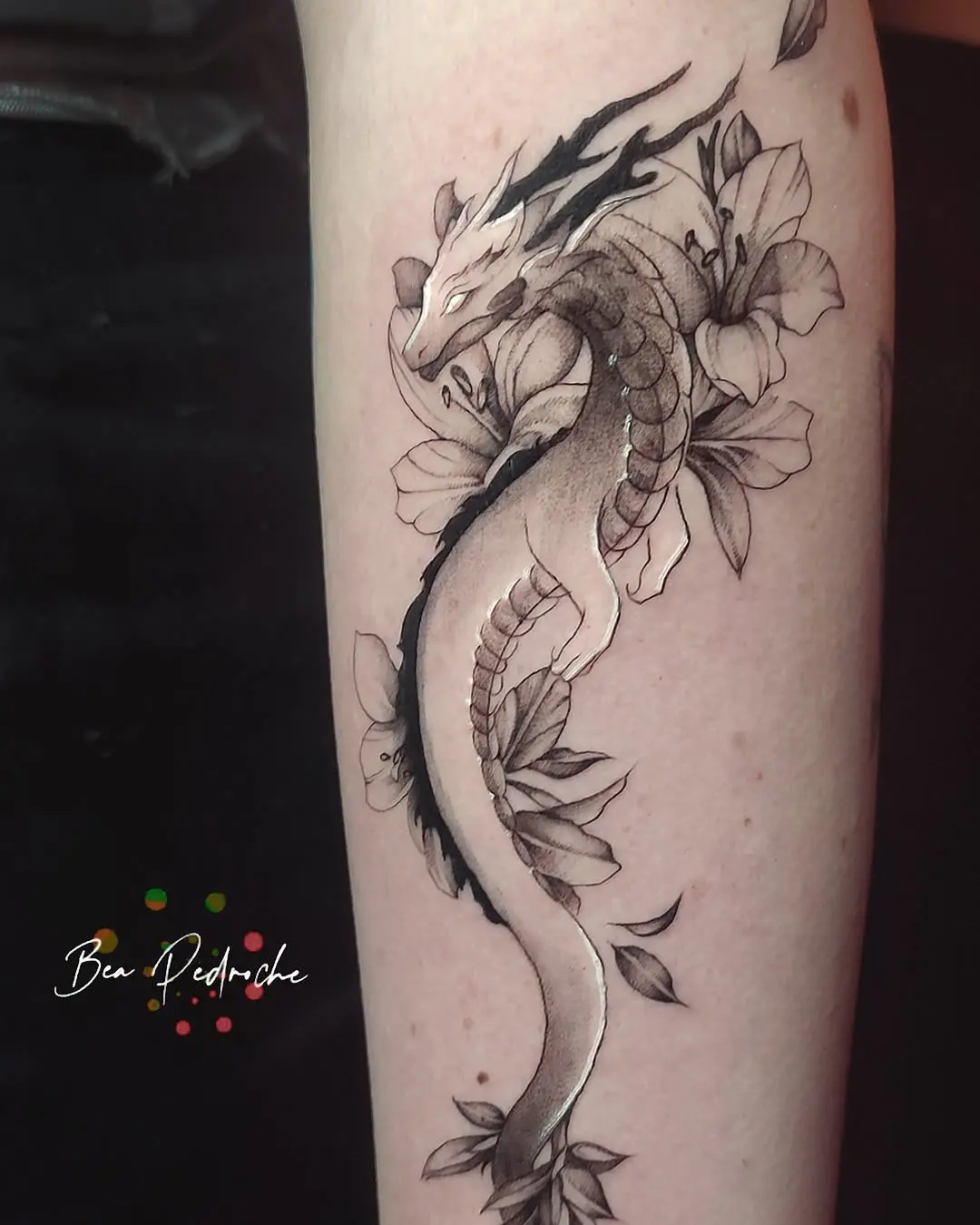 A graceful dragon entwined with blooming flowers