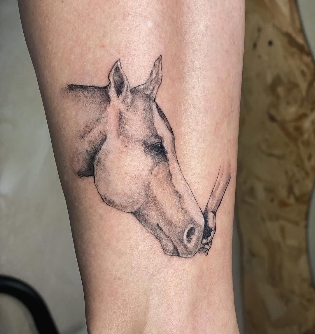 Stunning horse tattoo with a human touch