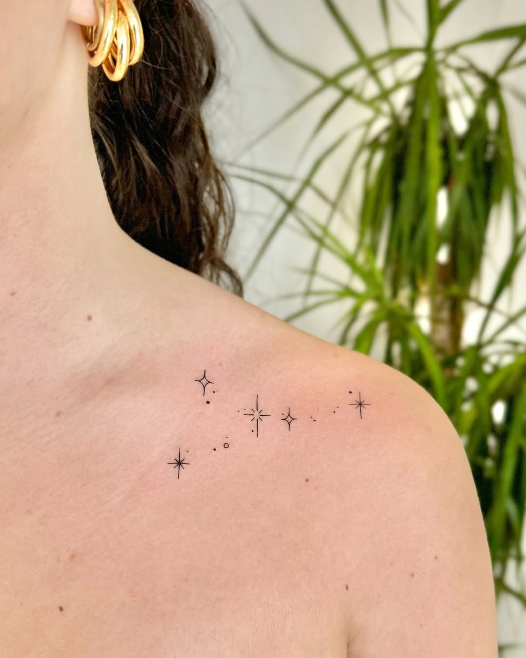 Stunning star tattoos with delicate dot accents.