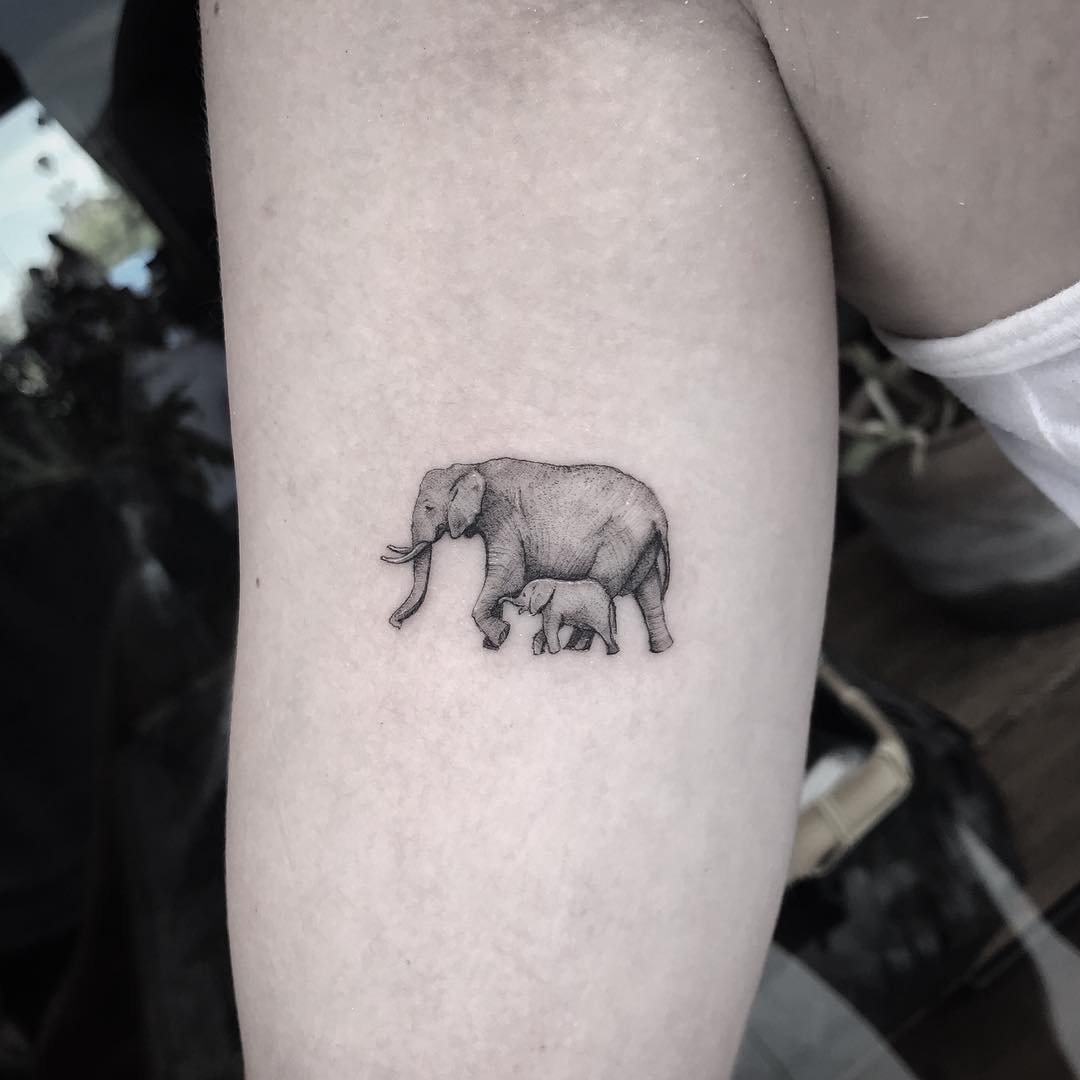 Beautiful elephant family tattoo on the forearm