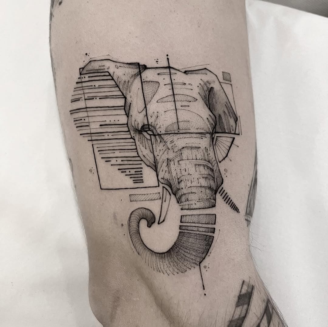 Geometric elephant head tattoo with sharp lines