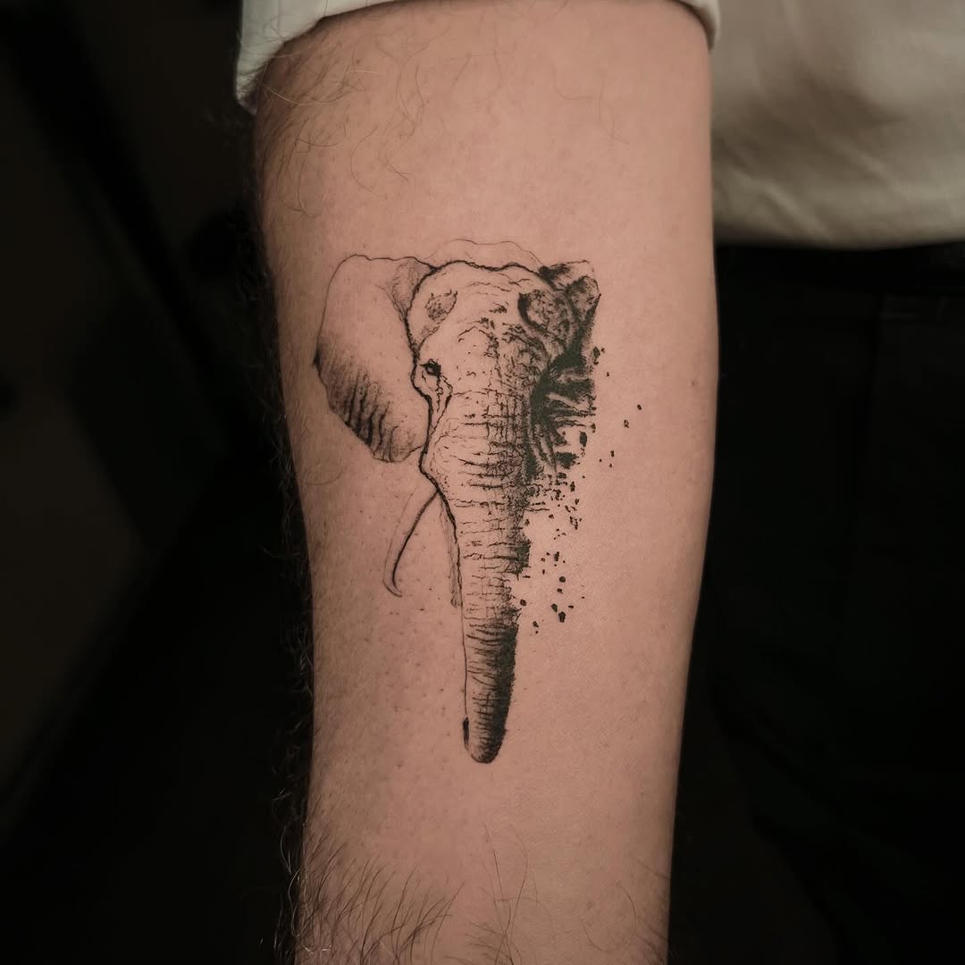 Elegant Minimalist Elephant Head Tattoo Design