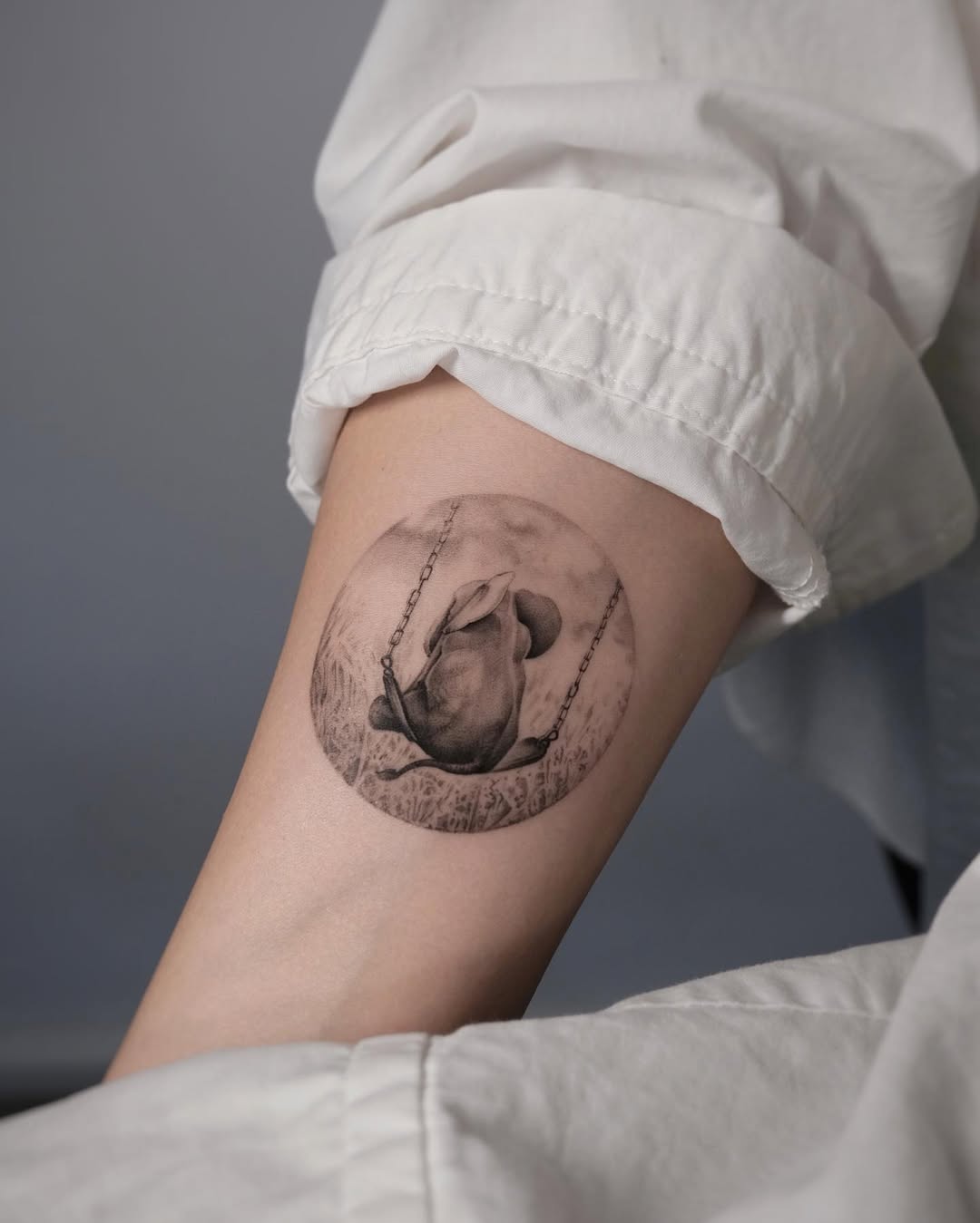 Elegant Elephant Tattoo on a Swing