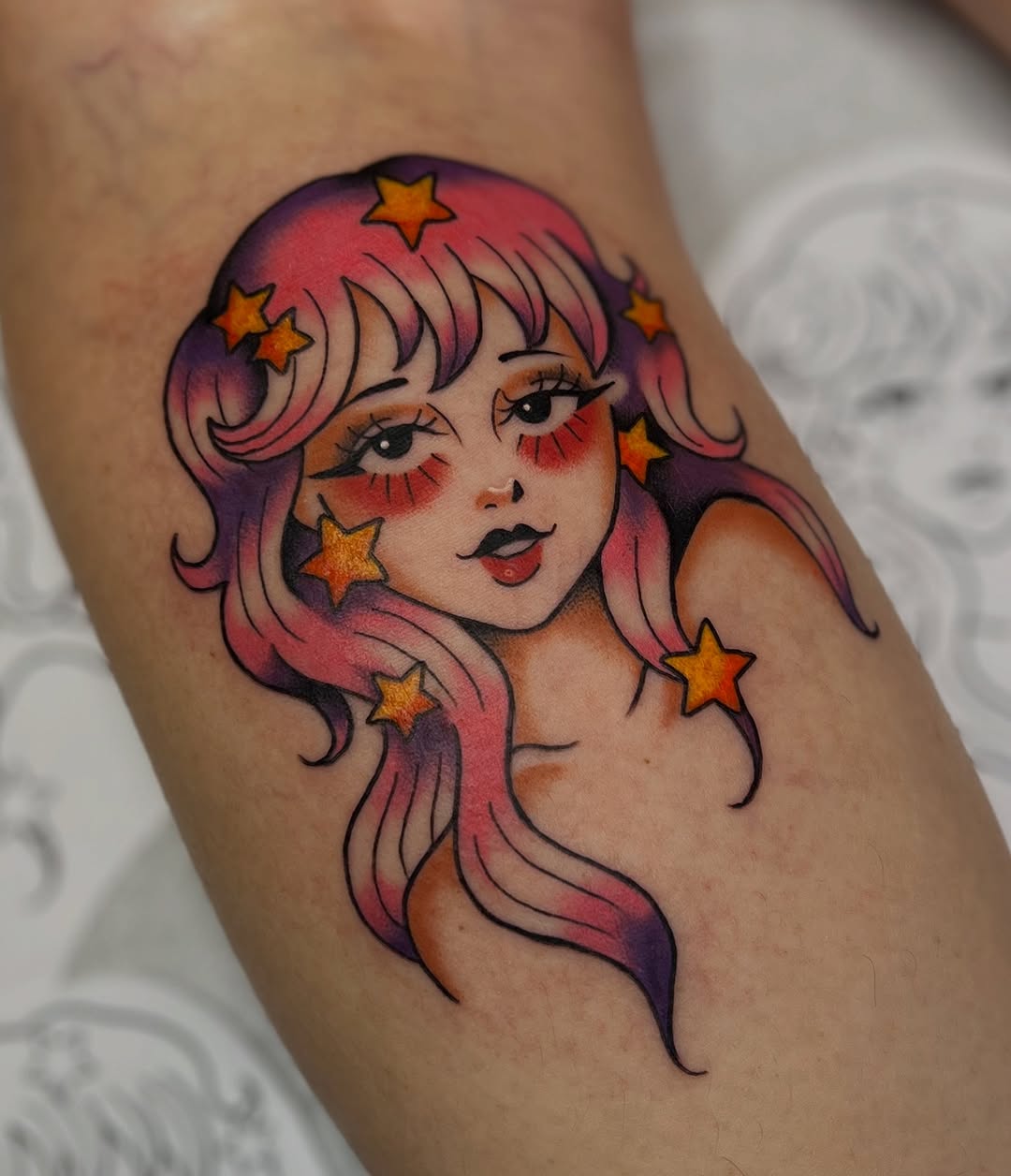 Stunning star-adorned tattoo of a woman