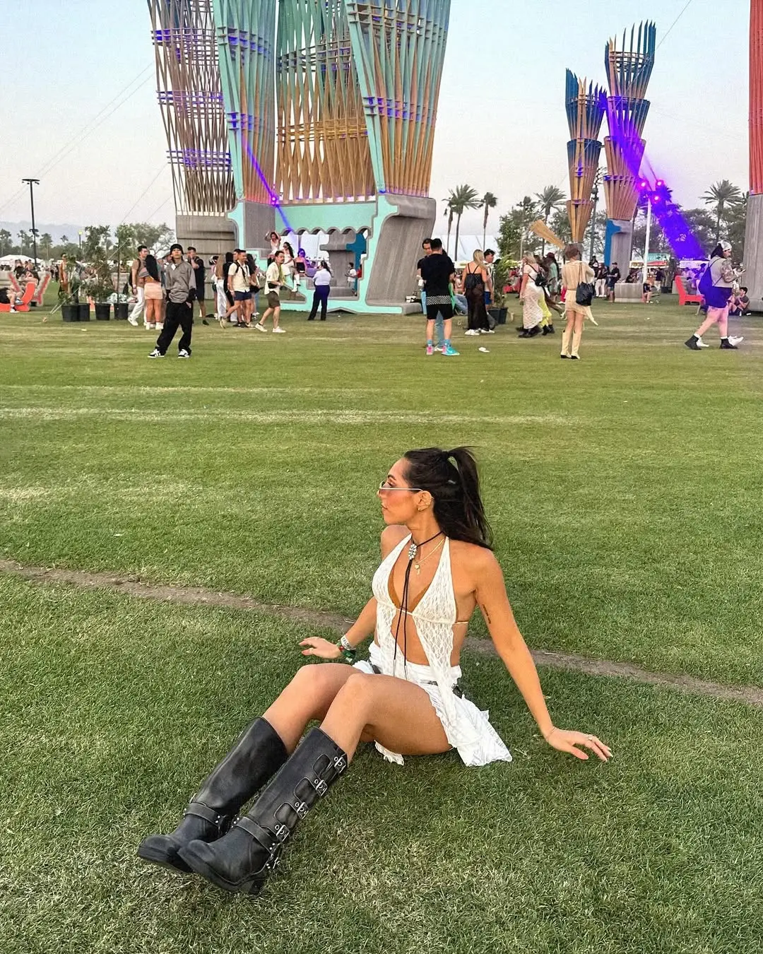 Chic white dress with edgy knee-high boots