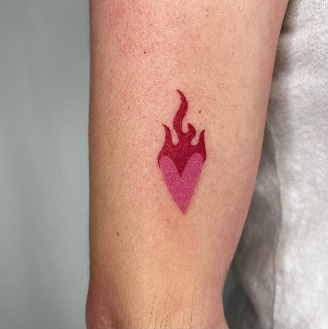 Unique heart tattoo with flame details