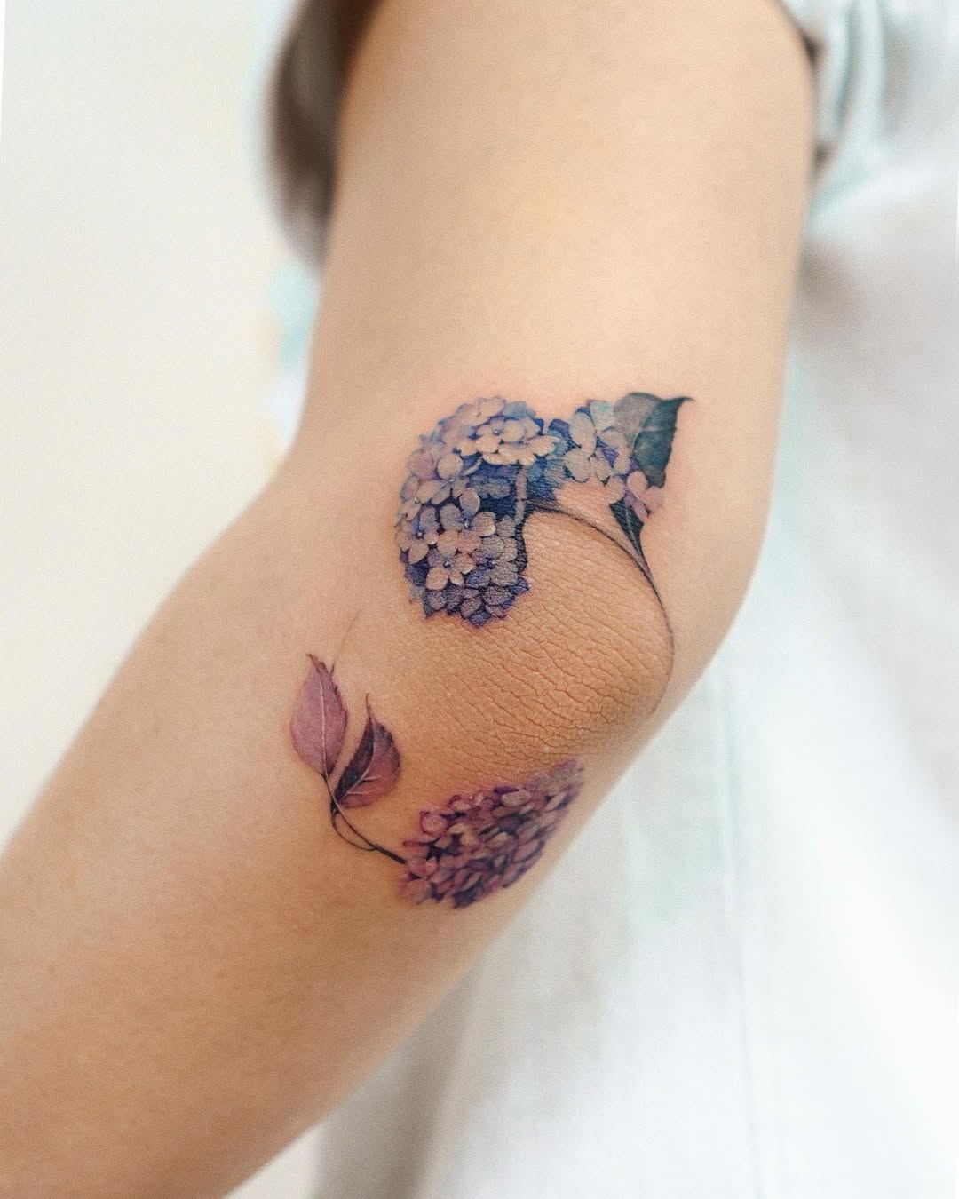 Stunning floral elbow tattoo with intricate details