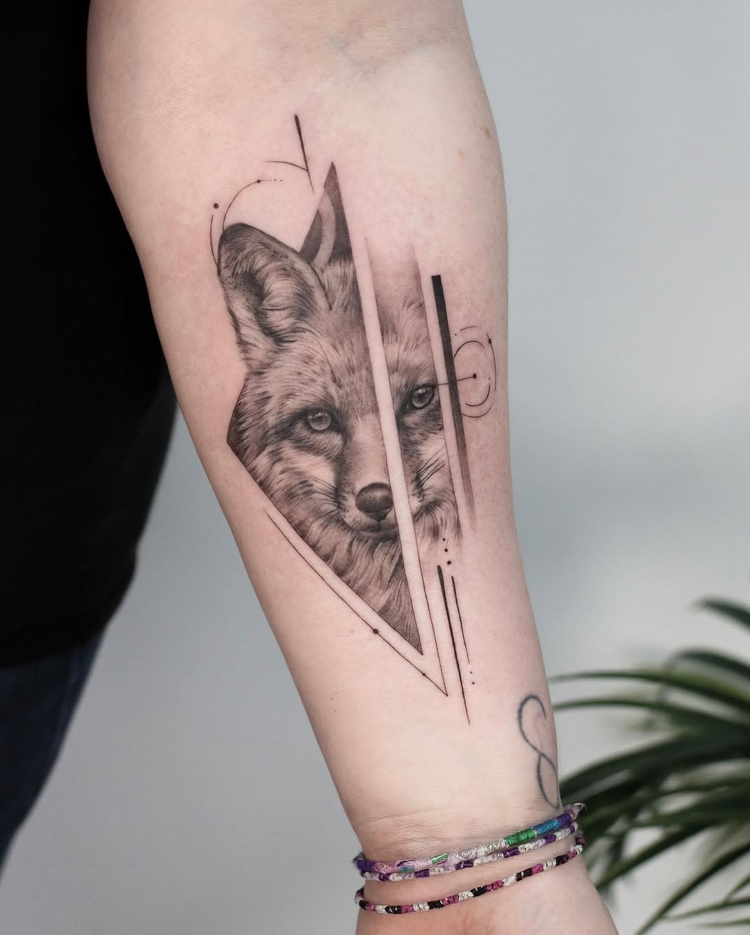 Stylish fox tattoo with abstract accents