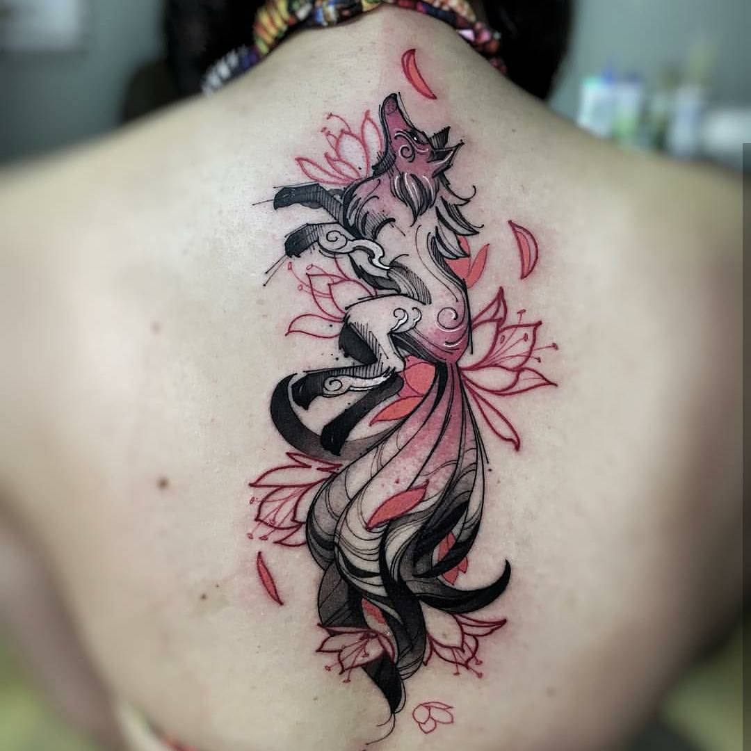 Graceful fox tattoo with floral elements