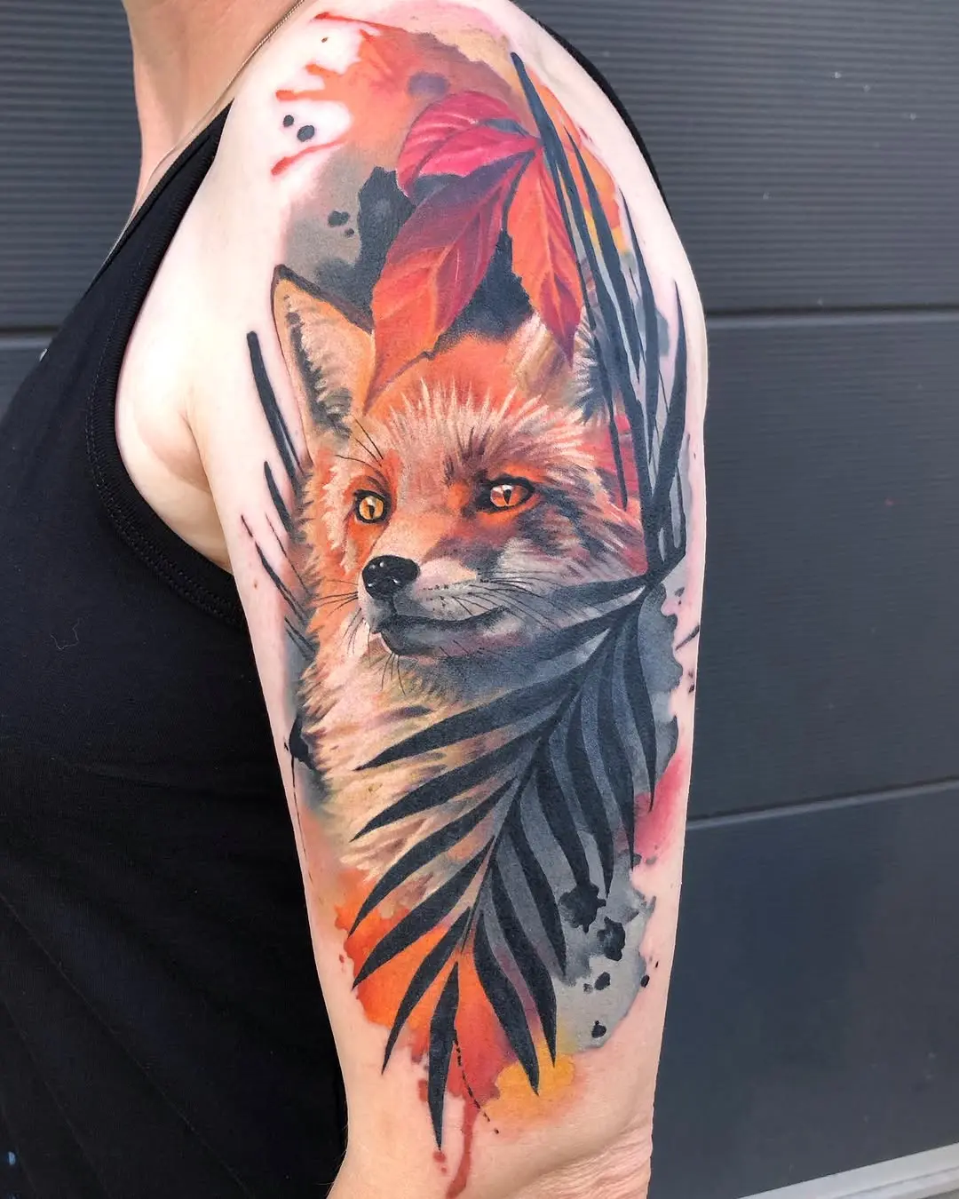 Stunning fox tattoo with tropical leaves design