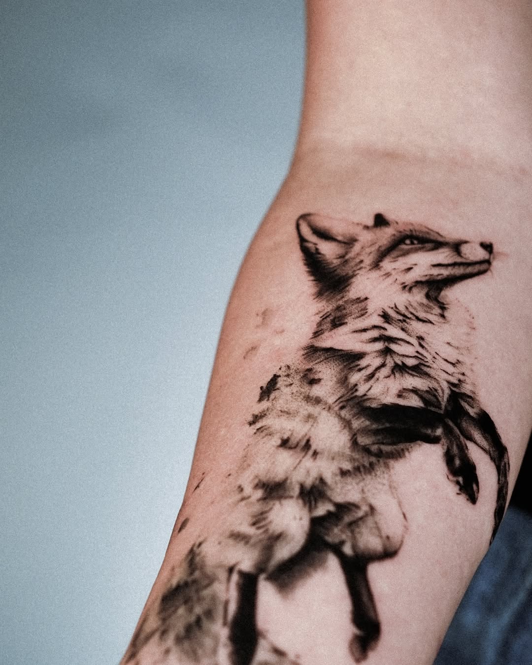 Charming fox tattoo in elegant black ink