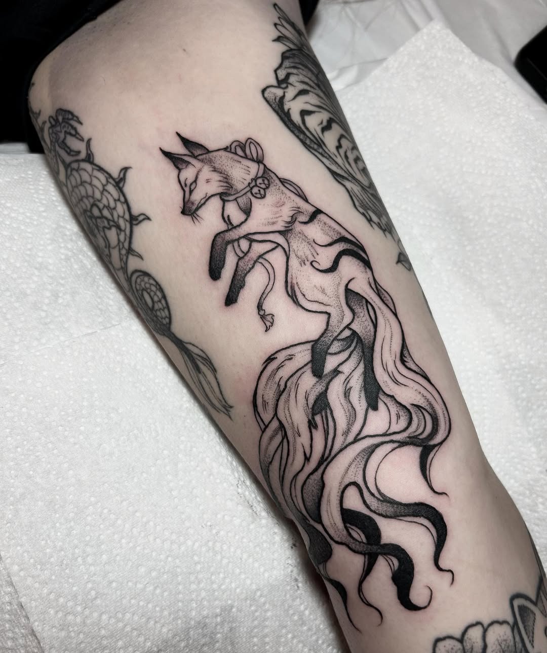 Elegant fox tattoo with flowing mane