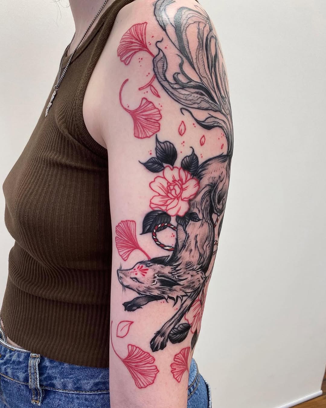 Vibrant fox tattoo with floral elements