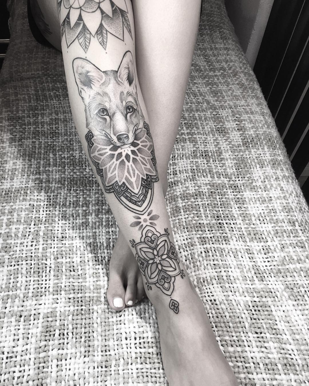 Elegant fox tattoo with floral elements