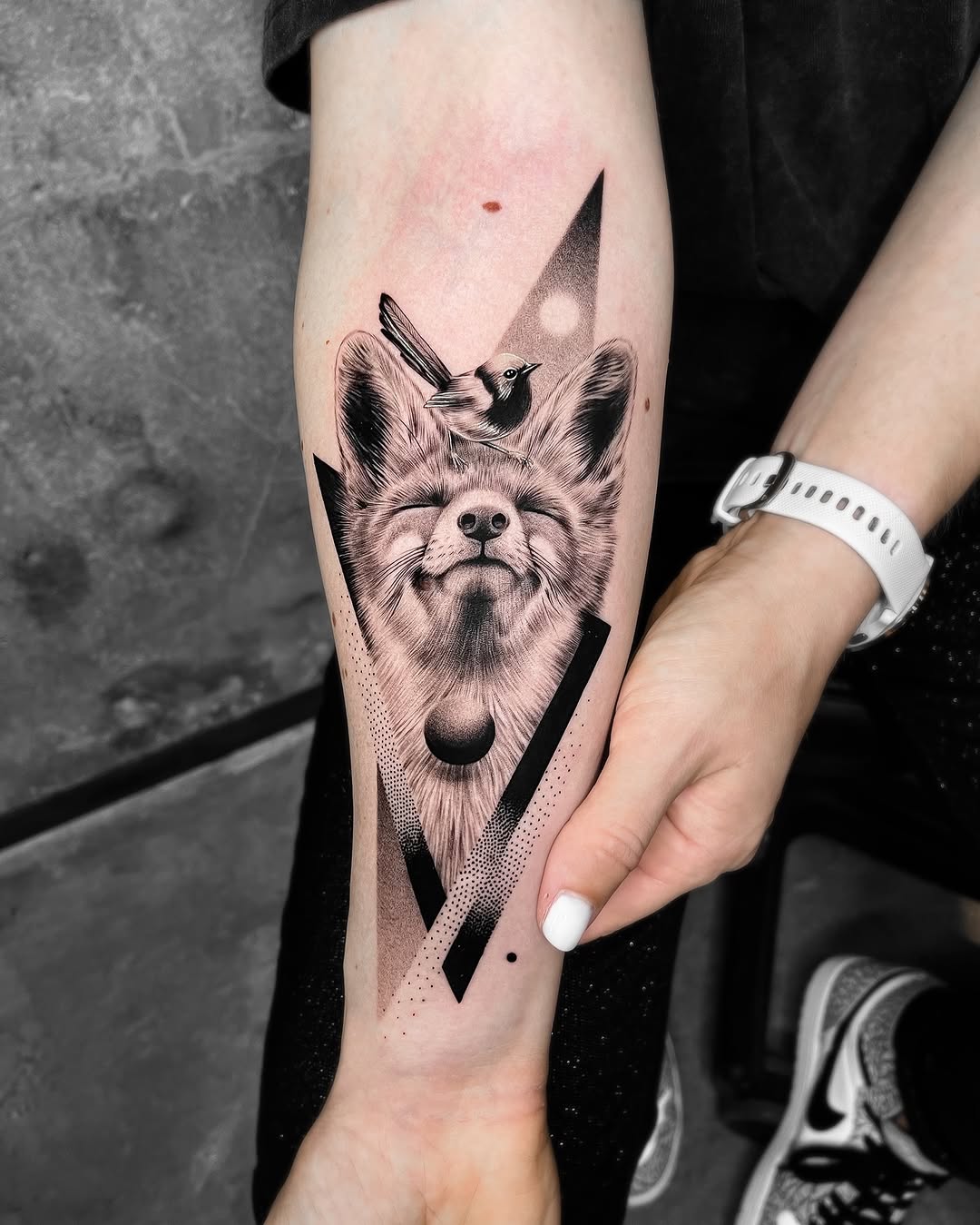 Artistic geometric fox tattoo with a bird