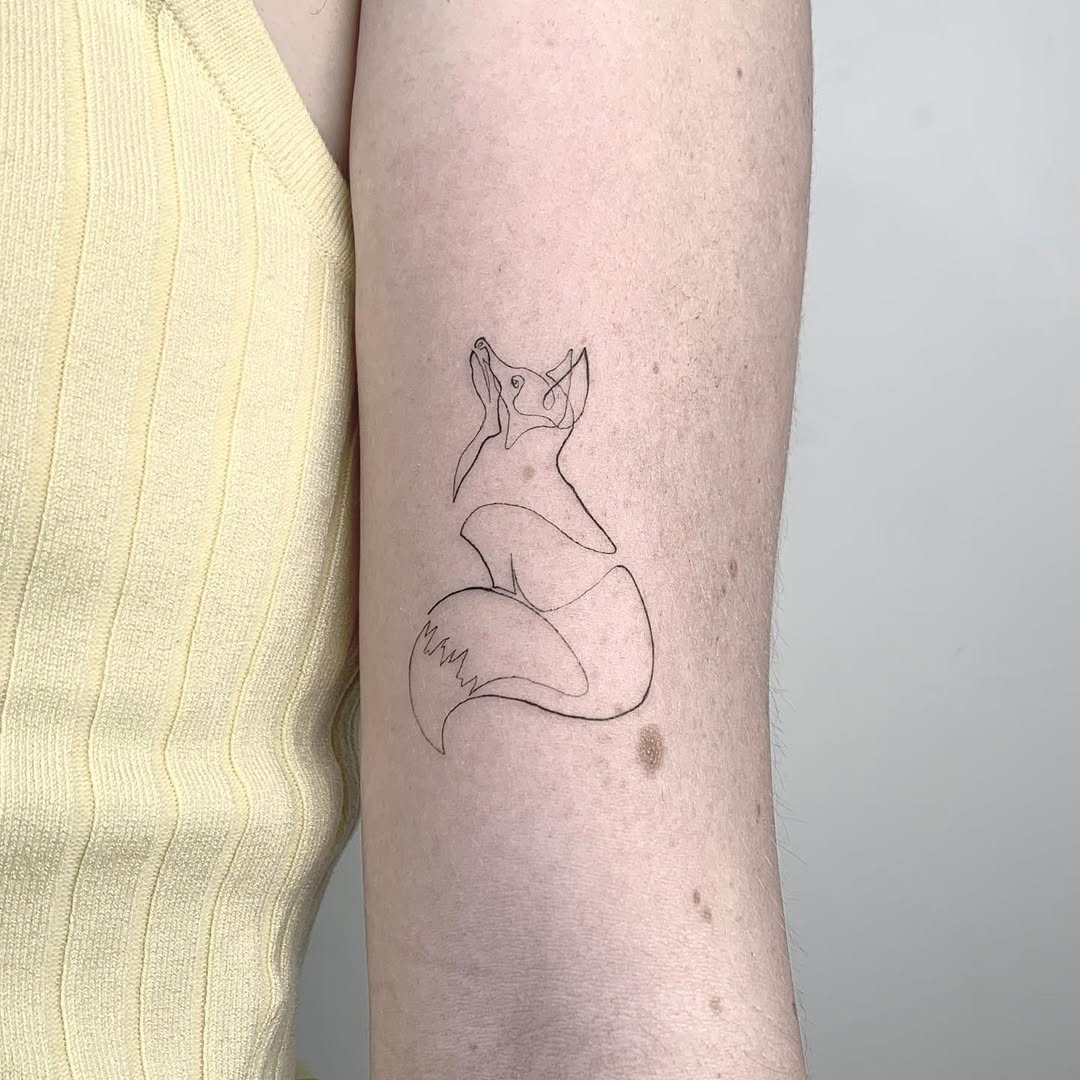 Elegant minimalist fox tattoo in line art