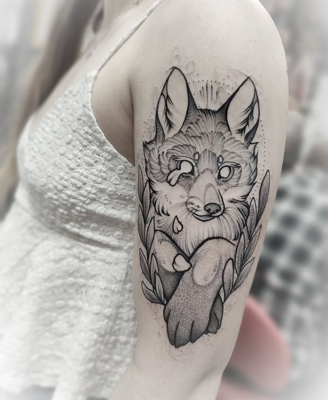 Intricate blackwork fox tattoo with lush details