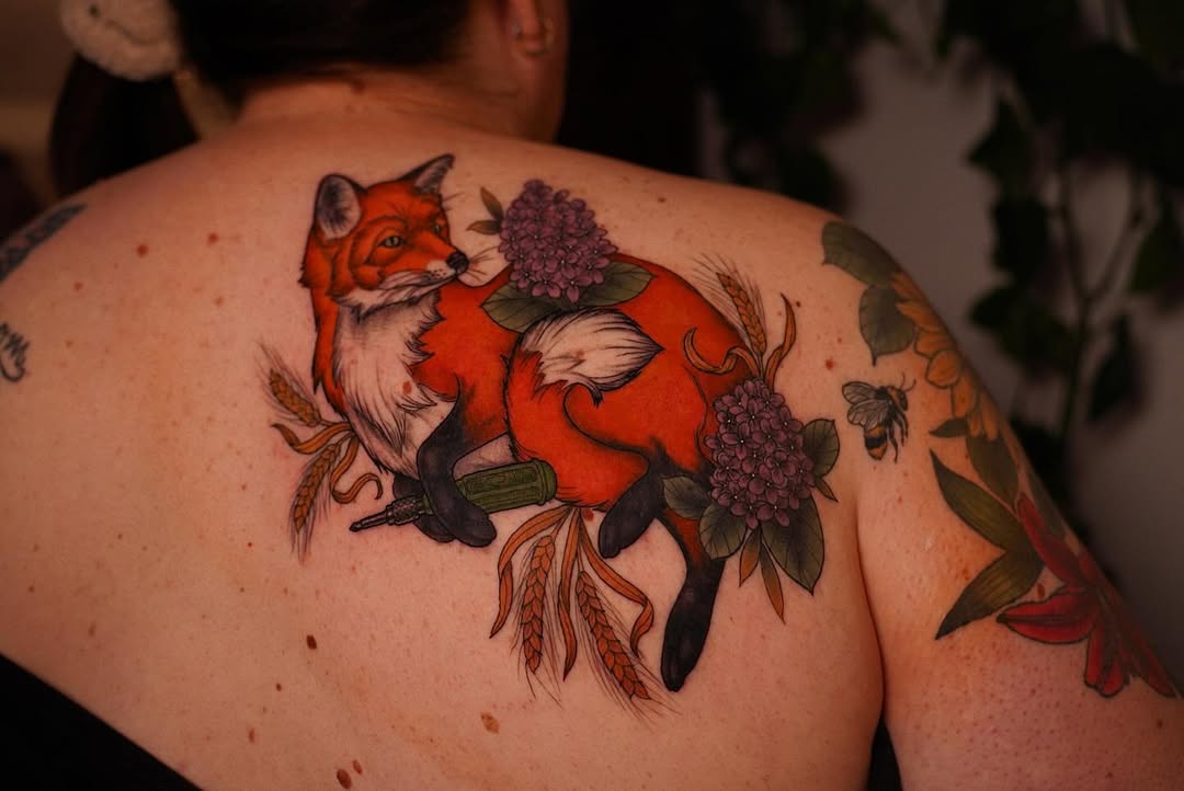 Stunning fox tattoo with floral details
