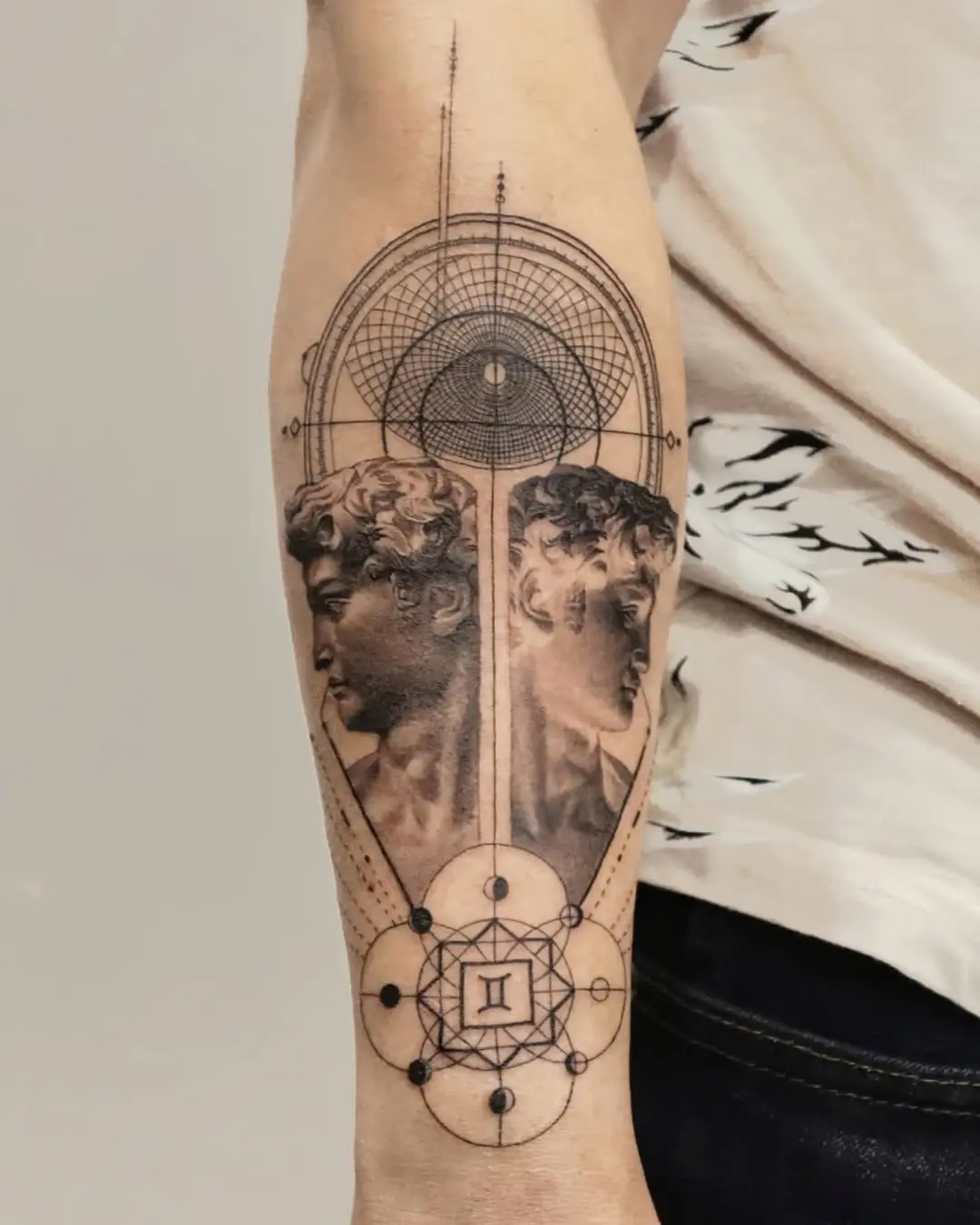 Stylish Gemini tattoo blending art and astrology