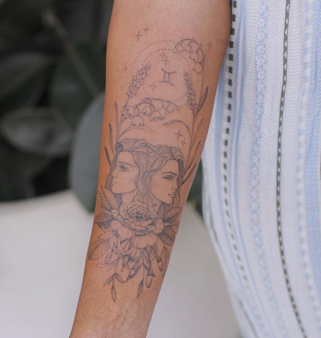 Elegant Gemini Tattoo with Floral Elements