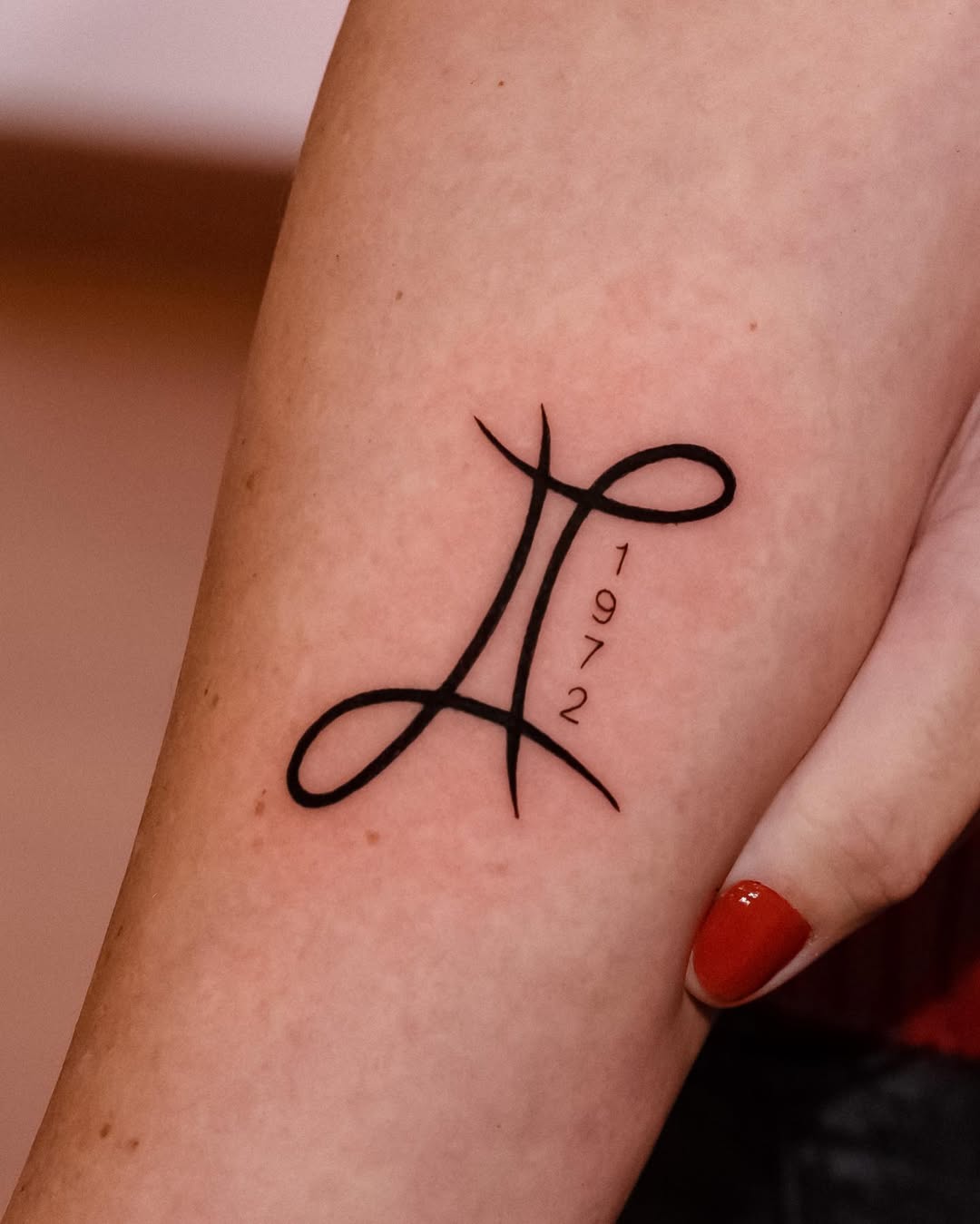 Sleek Minimalist Gemini Tattoo Design