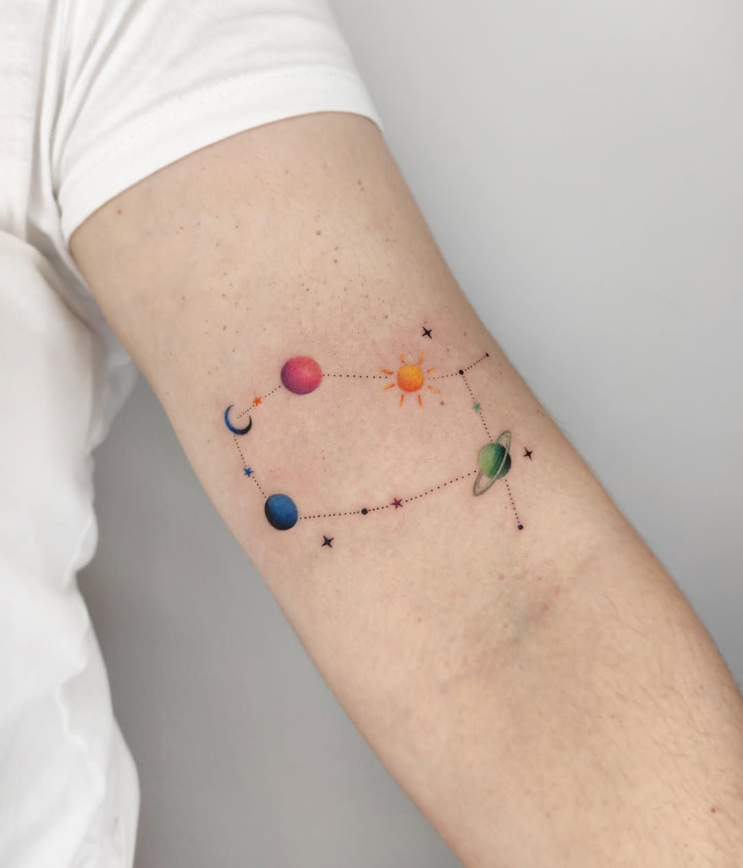 Colorful cosmic Gemini constellation tattoo design