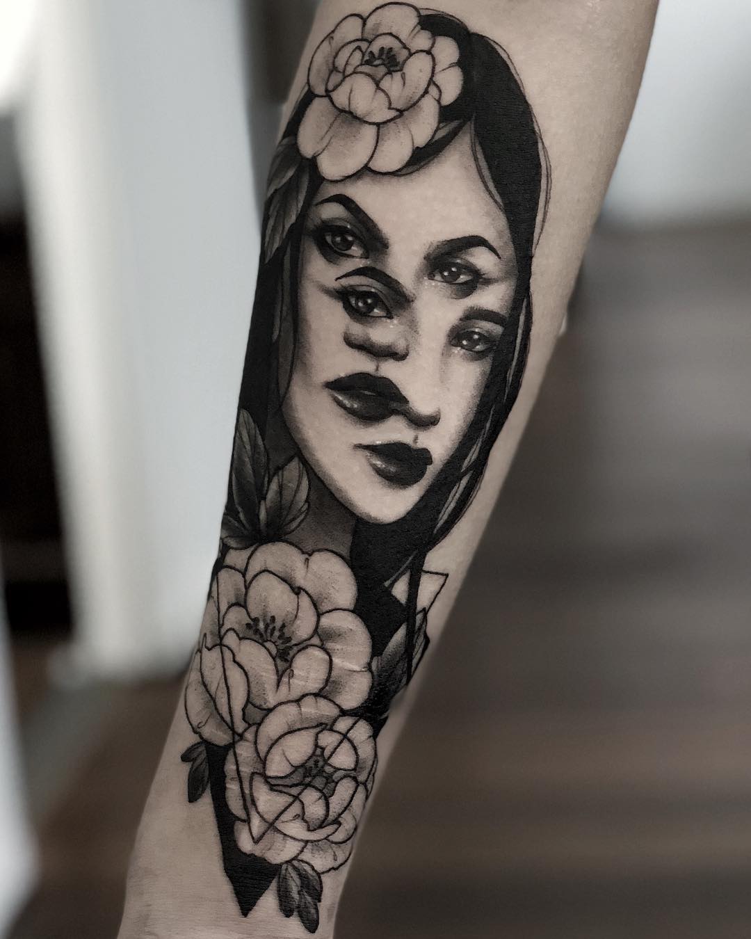 Stunning Gemini Tattoo with Floral Elements