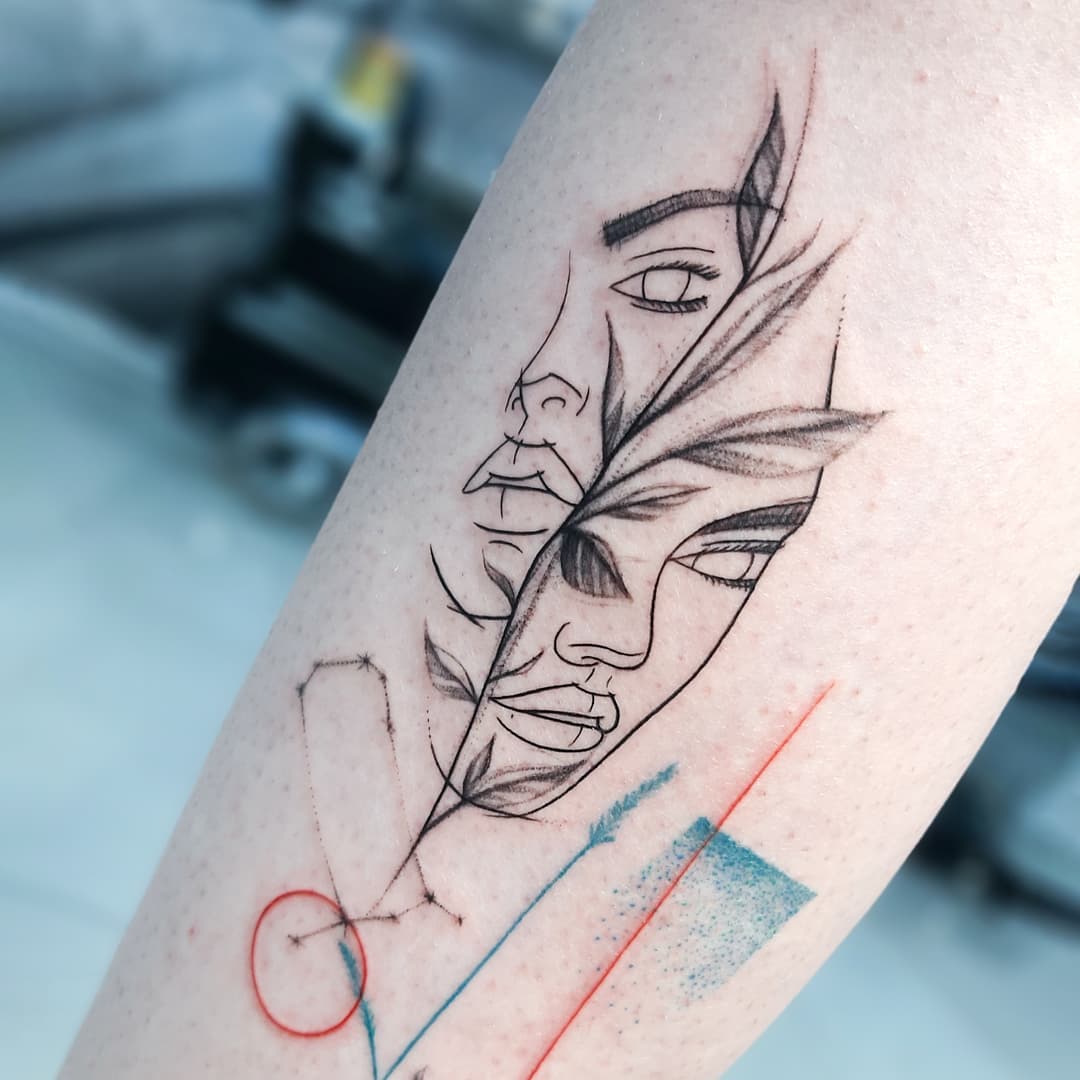 Elegant Gemini Tattoo with a Unique Leaf Design