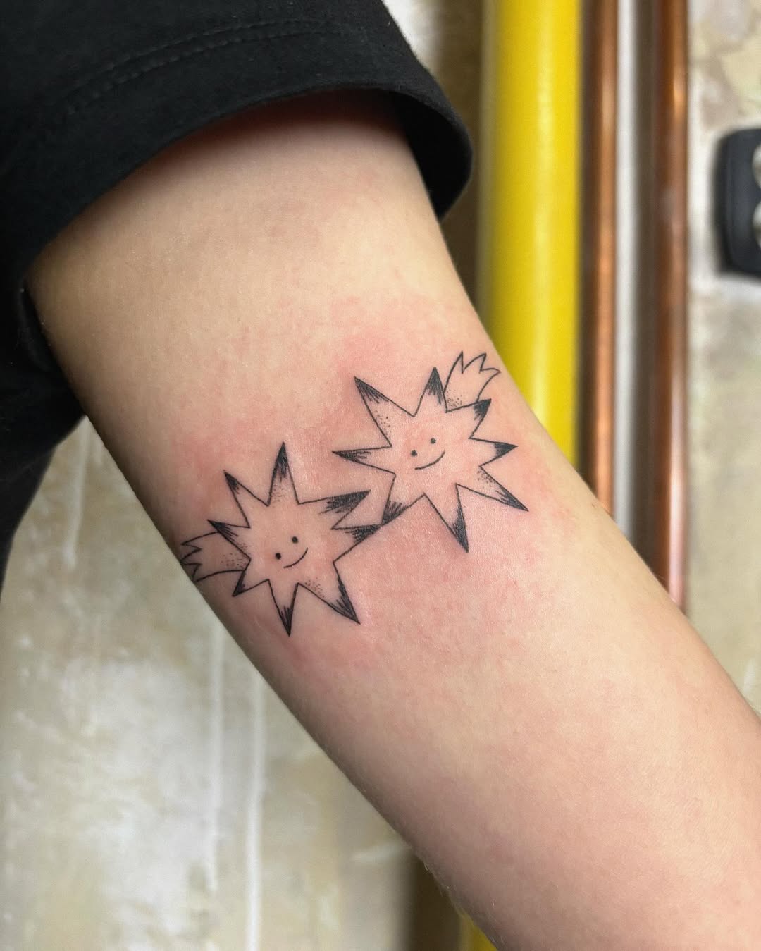 Charming smiling star tattoos for joyful vibes