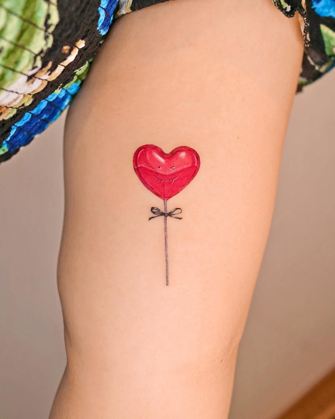 Charming red heart balloon tattoo design