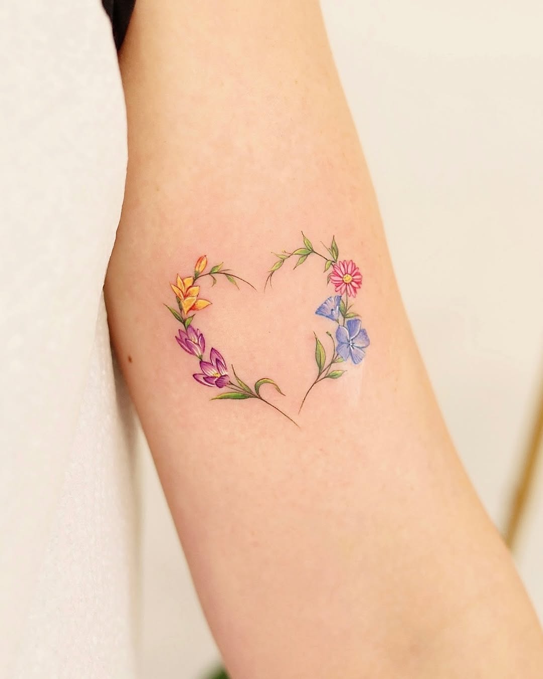 Colorful floral heart tattoo design with elegance