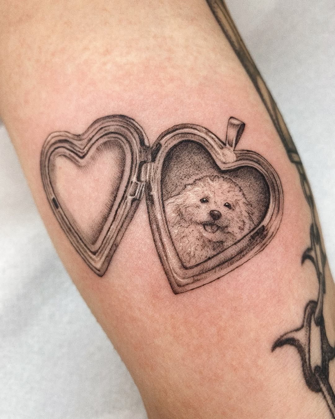 Adorable heart frame dog portrait tattoo design