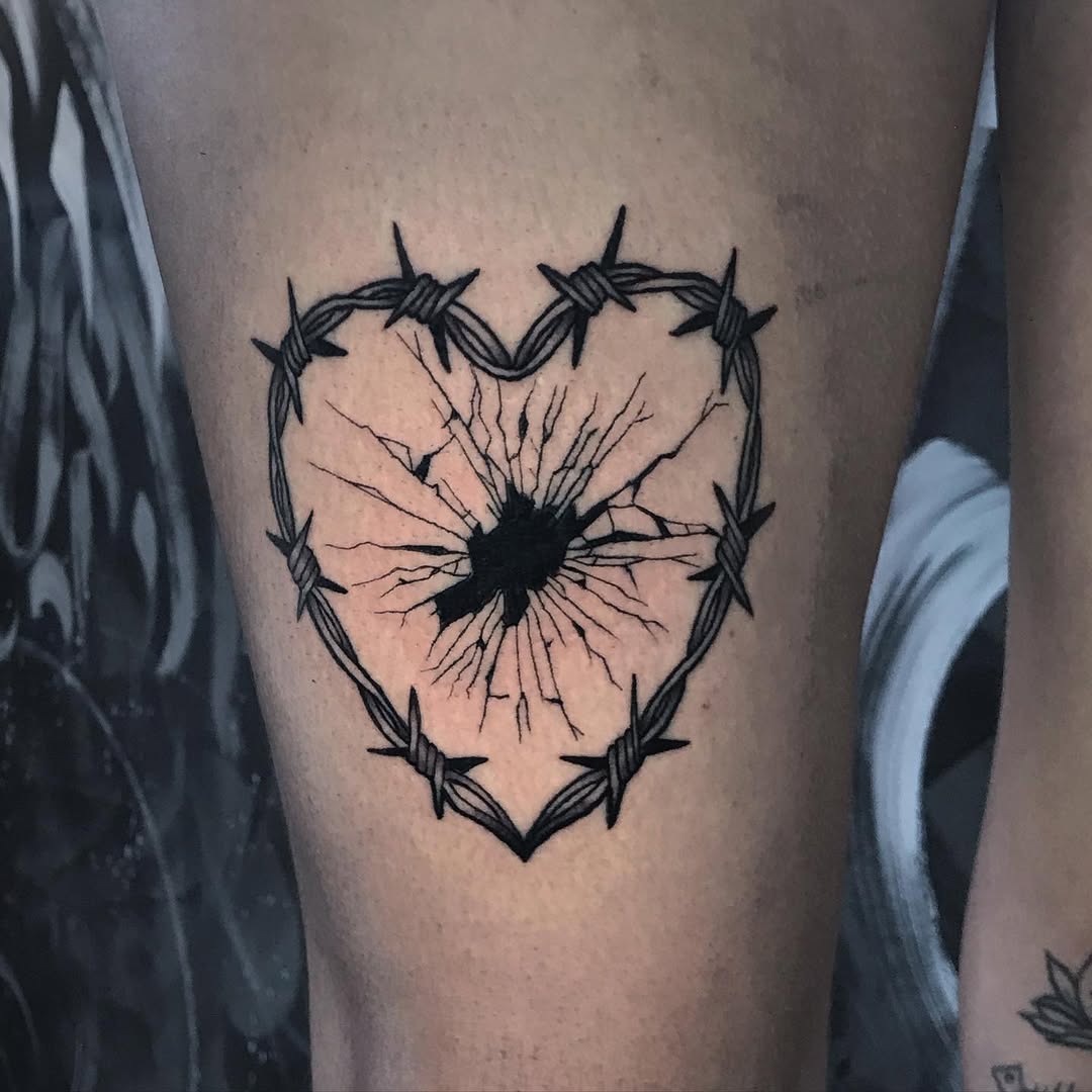 A striking heart tattoo with edgy details