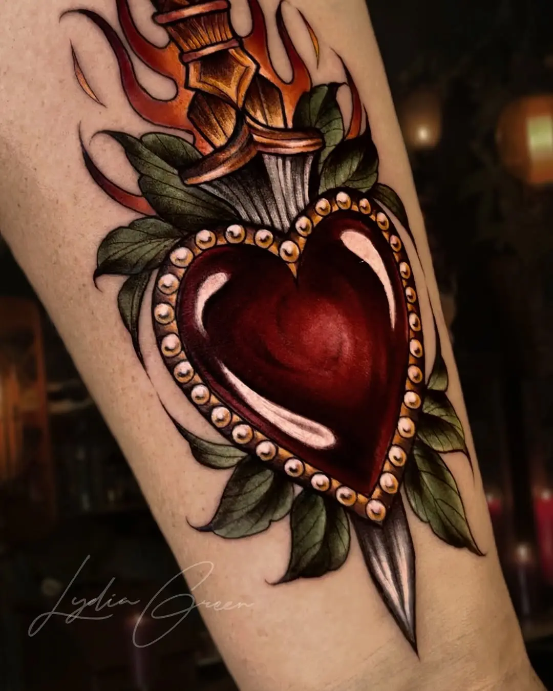 Exquisite heart tattoo with dagger and flames