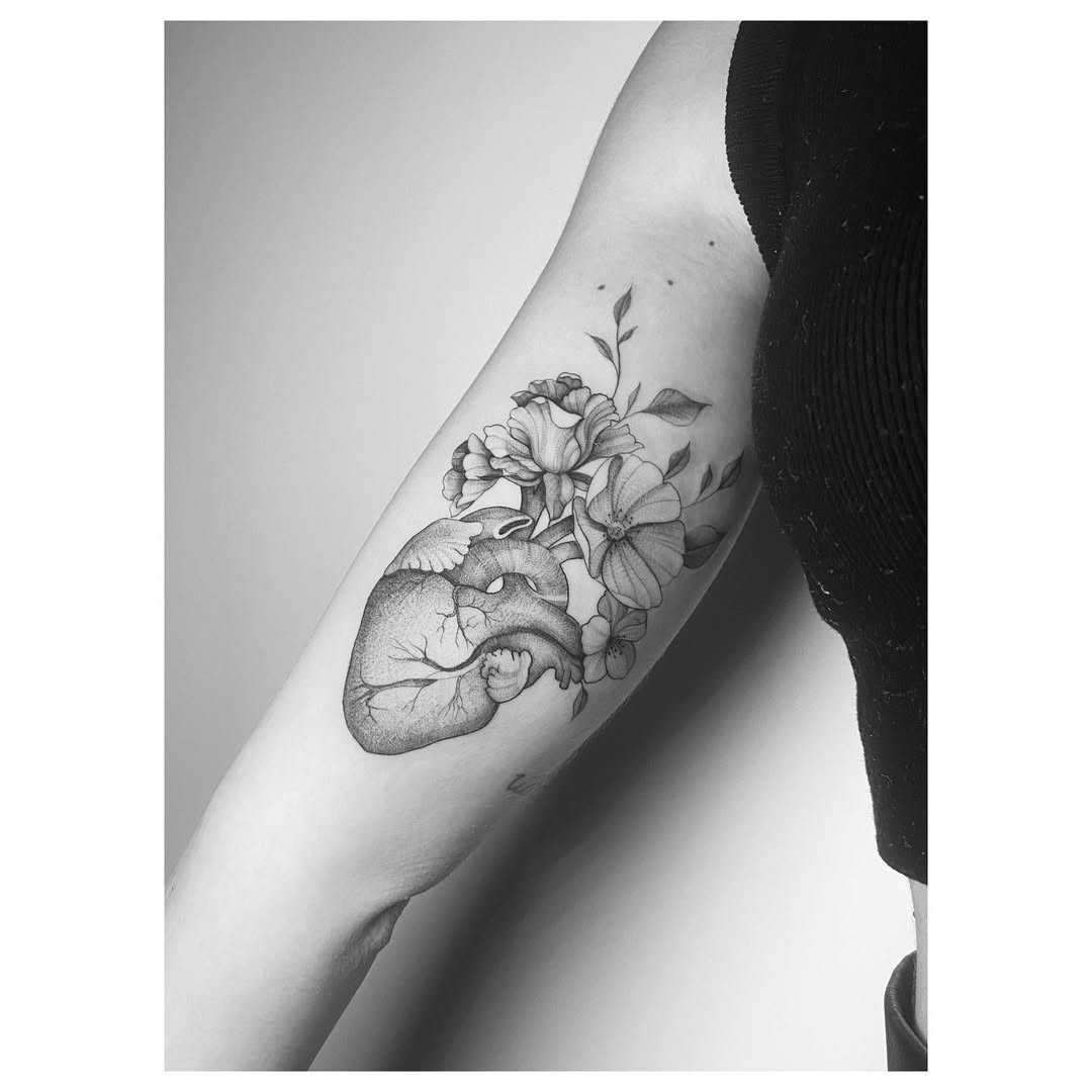 Stylish heart tattoo with floral elements