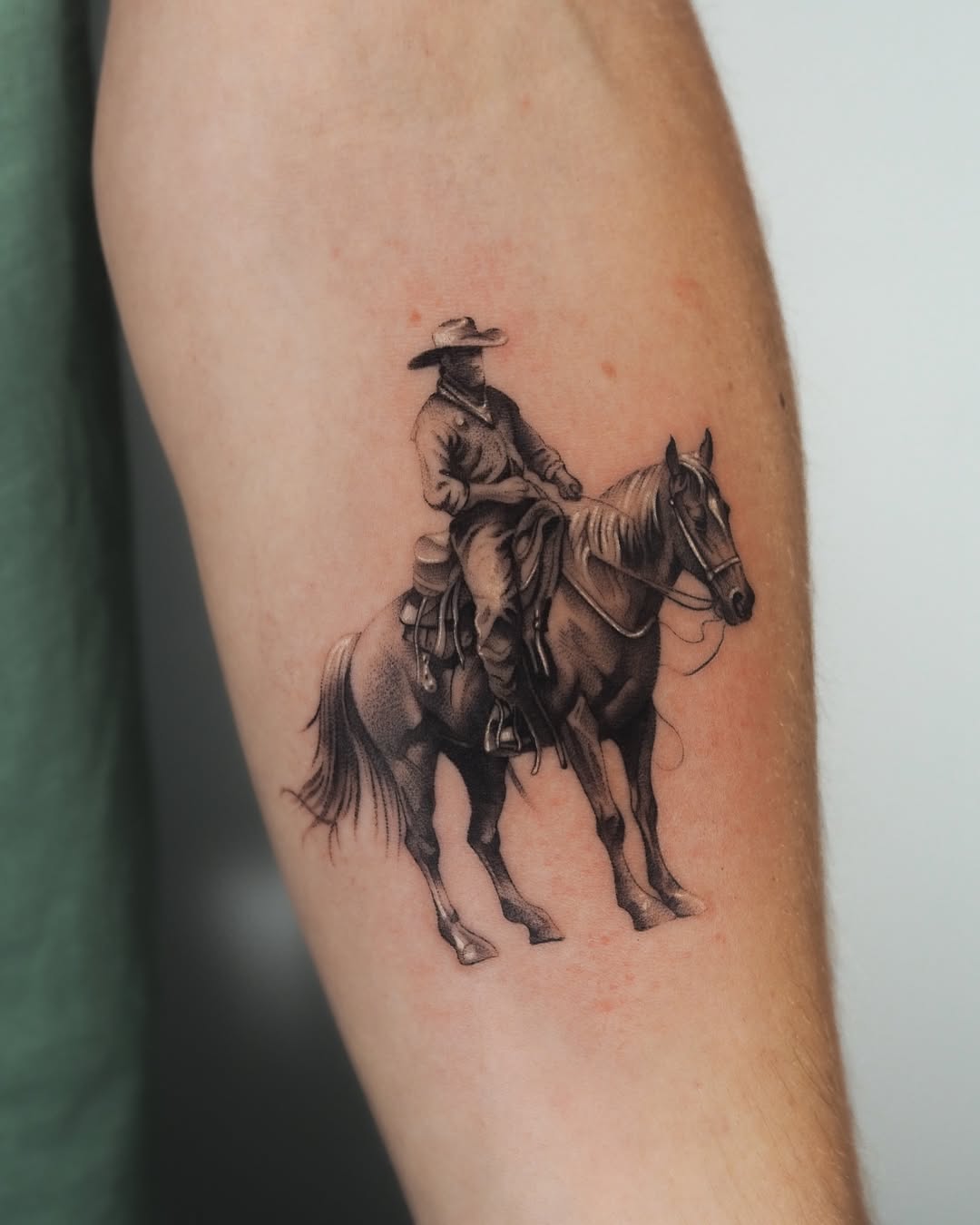 Realistic cowboy riding a beautiful horse tattoo