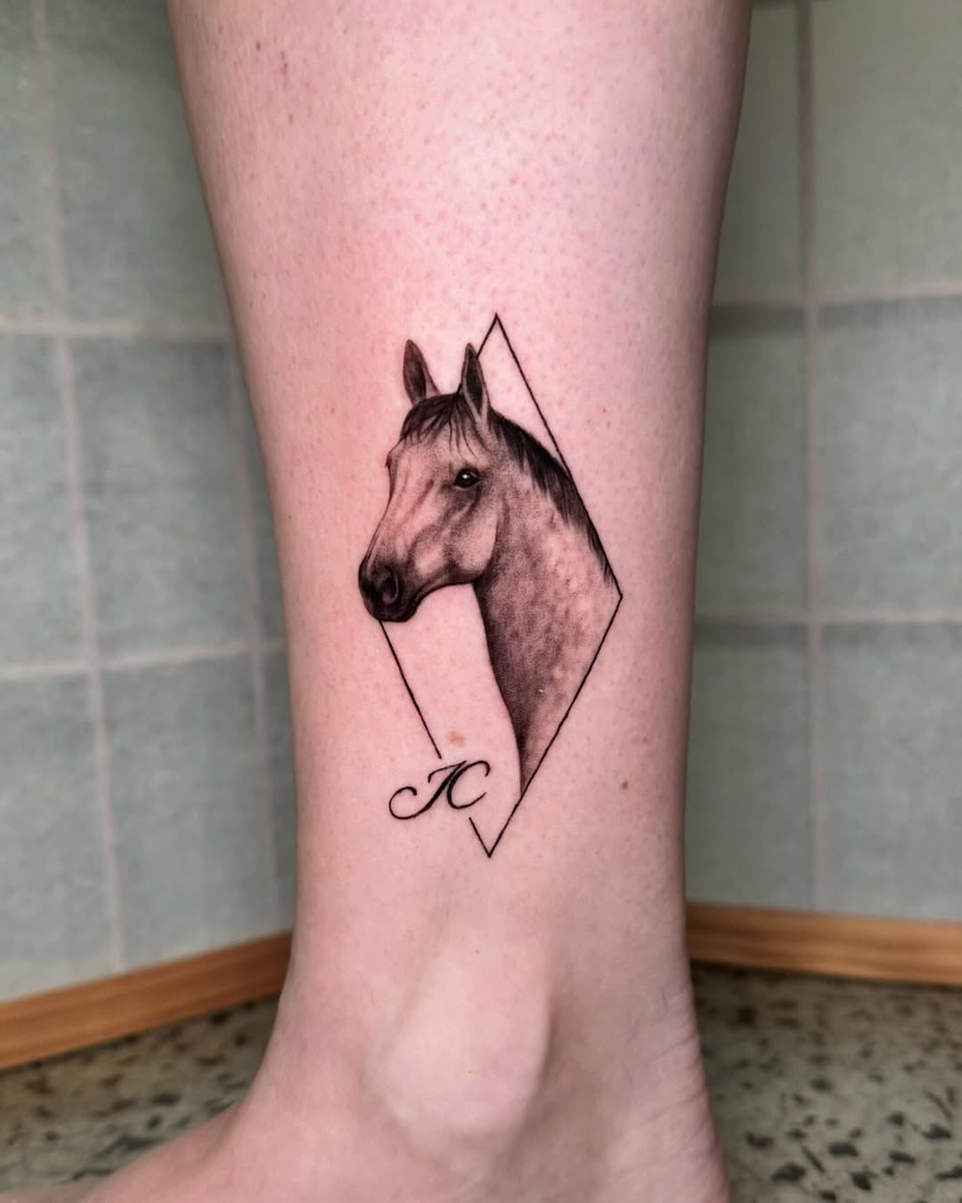 Elegantly crafted horse tattoo with geometric design