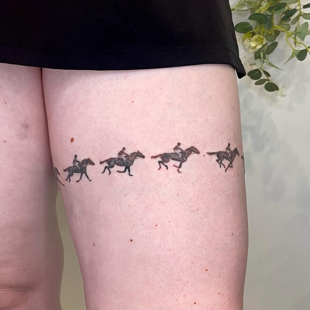 Flowing horse tattoo design on thigh